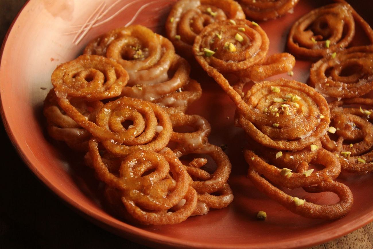 Spiral jalebi on a clay dish