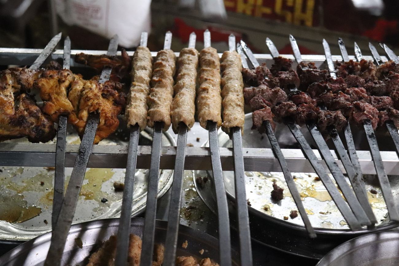 Seekh kebabs and chicken on skewers at a Karachi grill