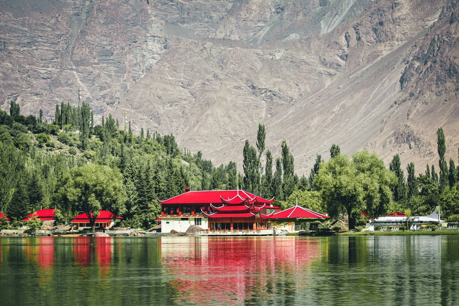 Red roofs reflected in Lower Kachura Lake, Skardu